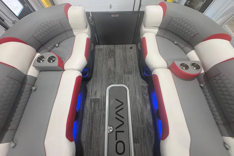 Slide: The Image of 2025 Avalon Catalina Cruise interior with plush seating, cup holders, and ambient blue lighting. - 21