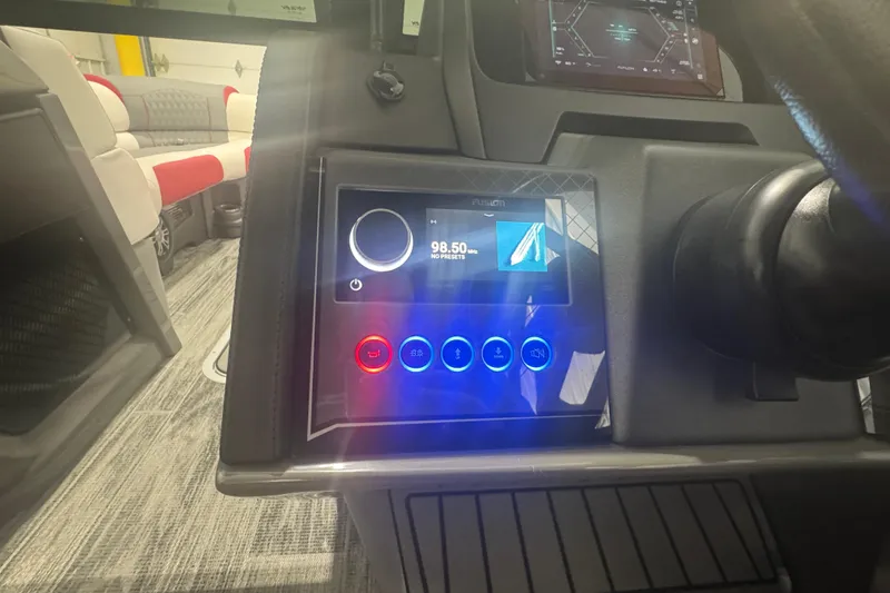 Slide: The Image of 2025 Avalon Catalina Cruise dashboard with modern touchscreen controls and rear bench seating. - 23