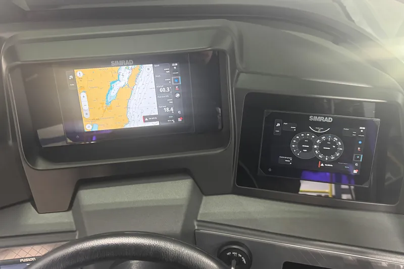 Slide: The Image of Dashboard of 2025 Avalon Catalina Cruise with Simrad navigation displays. - 24