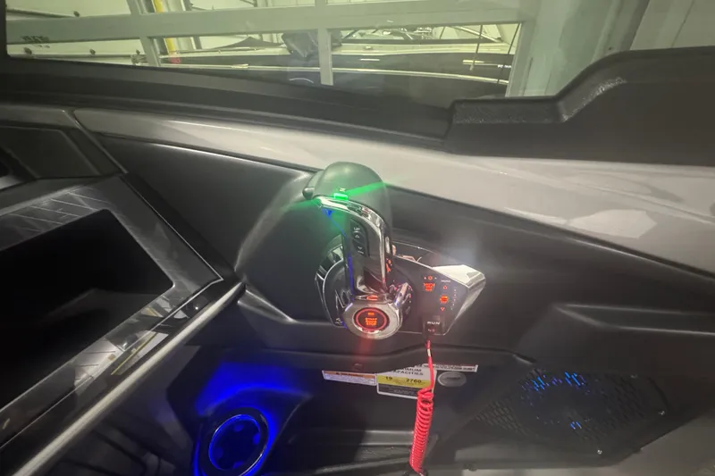 Slide: The Image of Control panel of 2025 Avalon Catalina Cruise Rear Bench Windshield boat, featuring illuminated controls. - 5