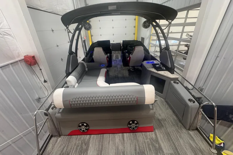 Slide: The Image of 2025 Avalon Catalina Cruise Rear Bench Windshield boat interior with modern seating and sleek design. - 9