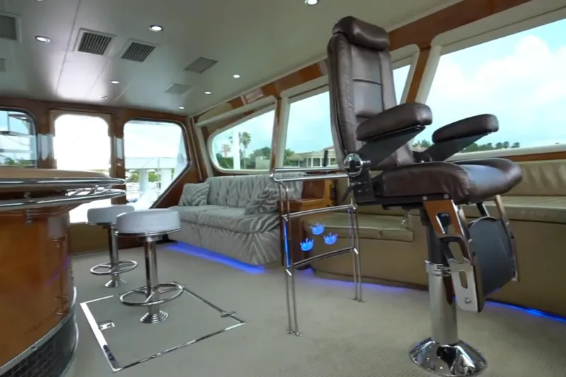 Slide: The Image of Luxurious interior of a 1987 Magnum 70 Convertible yacht with plush seating and modern design. - 14