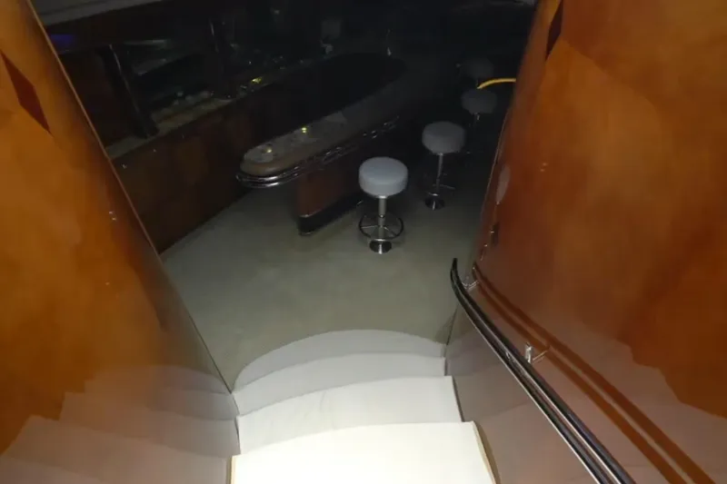 Slide: The Image of Interior of 1987 Magnum 70 Convertible yacht with bar and stools. - 17