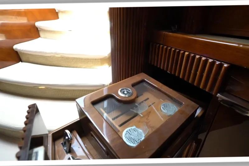 Slide: The Image of Luxurious interior of 1987 Magnum 70 Convertible yacht with elegant wooden finishes. - 21