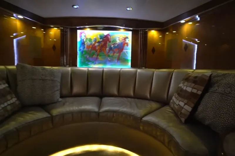 Slide: The Image of Luxurious interior of 1987 Magnum 70 Convertible with plush seating and vibrant artwork. - 23