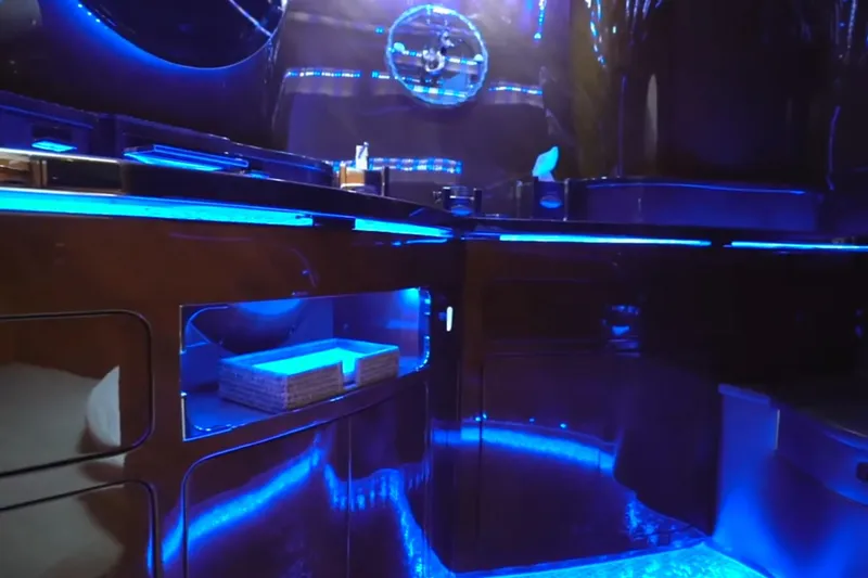 Slide: The Image of Luxurious interior of 1987 Magnum 70 Convertible with blue ambient lighting. - 25