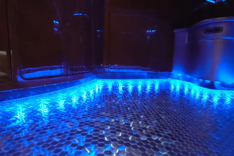 Slide: The Image of Illuminated interior of 1987 Magnum 70 Convertible with blue LED lighting and hexagonal floor pattern. - 26