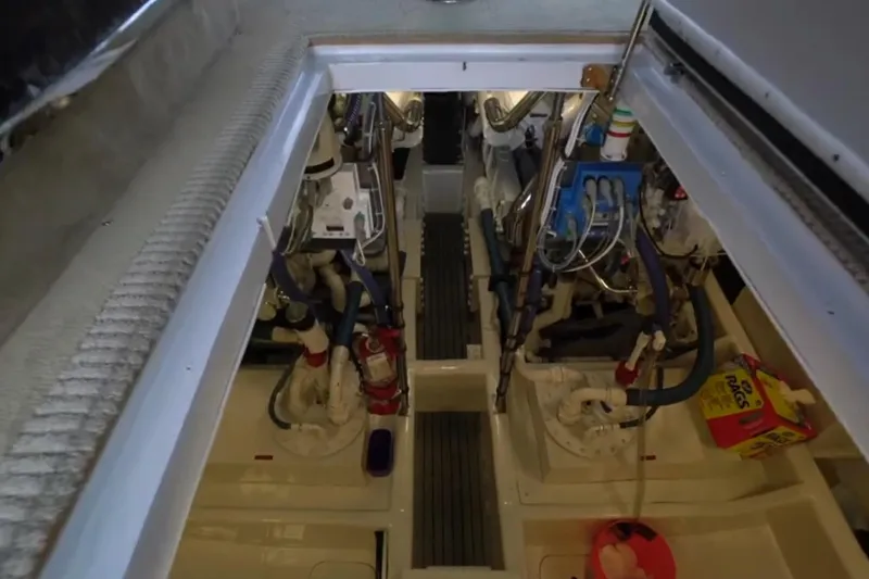Slide: The Image of Engine room of 1987 Magnum 70 Convertible yacht, showcasing mechanical components and equipment. - 29