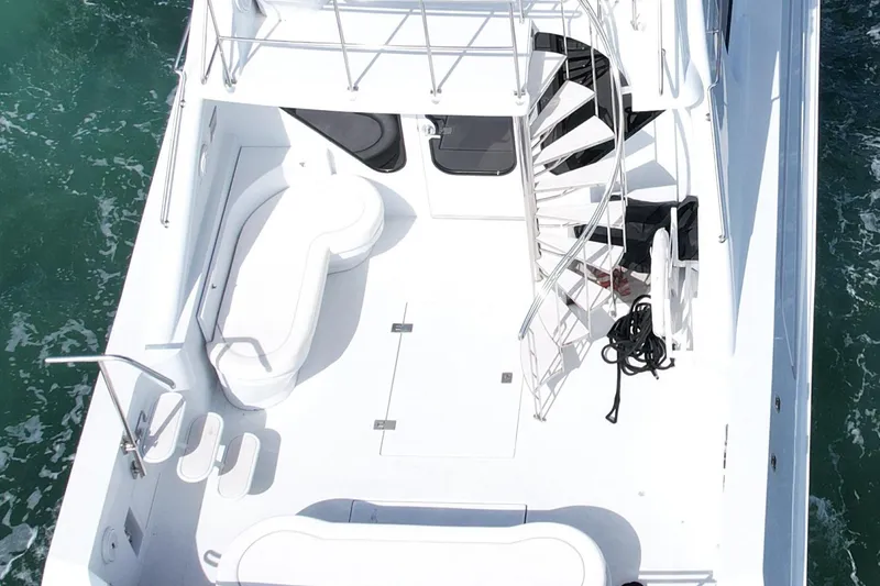 Slide: The Image of Aerial view of 1987 Magnum 70 Convertible yacht deck with spiral staircase. - 5
