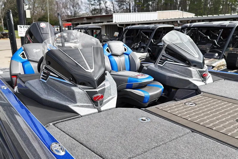 Slide: The Image of 2025 Ranger Z521R boat with sleek design and blue-accented seats. - 5