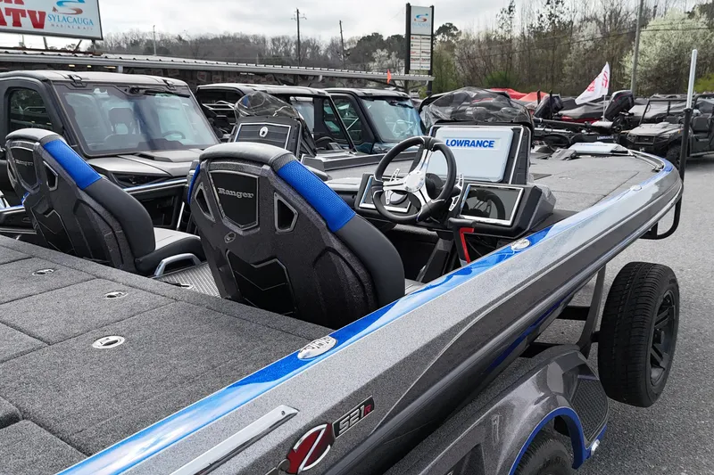 Slide: The Image of 2025 Ranger Z521R boat with advanced navigation system, parked outdoors. - 6