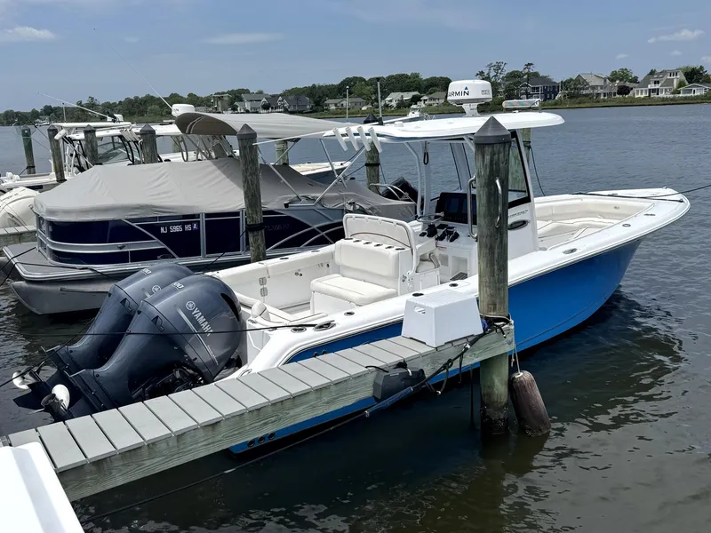 The Image of 2022 Sea Hunt Ultra 275 SE boat docked with twin Yamaha engines. - 0