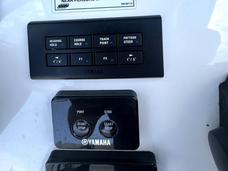 Slide: The Image of Control panel of a 2022 Sea Hunt Ultra 275 SE boat with Yamaha buttons. - 23