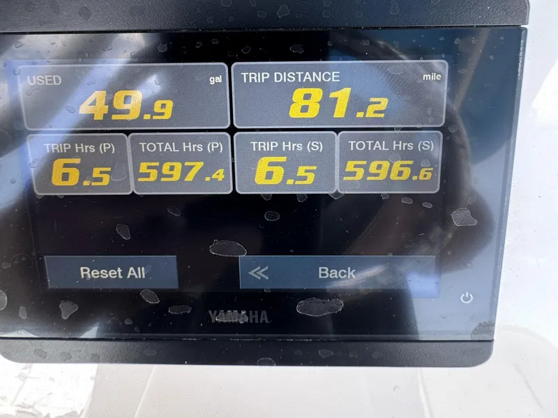 Slide: The Image of Display screen showing fuel usage and trip data for 2022 Sea Hunt Ultra 275 SE. - 26