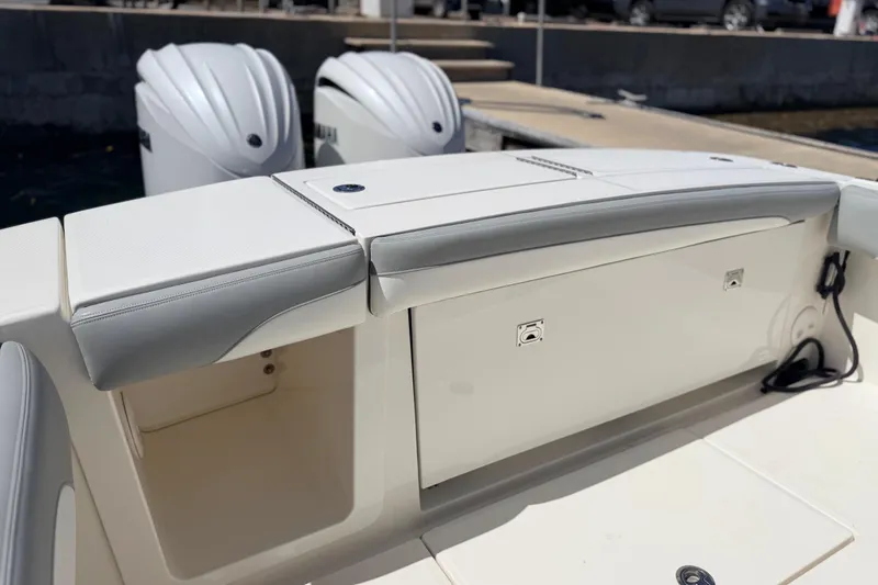 Slide: The Image of 2022 Regulator 28 boat with dual outboard engines at dock. - 12