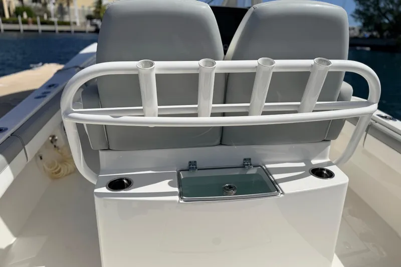 Slide: The Image of 2022 Regulator 28 boat interior with rod holders and seating. - 14