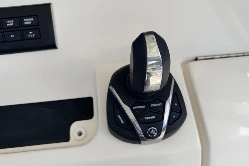 Slide: The Image of Joystick control panel on 2022 Regulator 28 boat, featuring navigation buttons. - 15