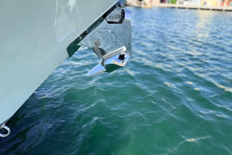 Slide: The Image of 2022 Regulator 28 boat anchor detail over clear blue water. - 16