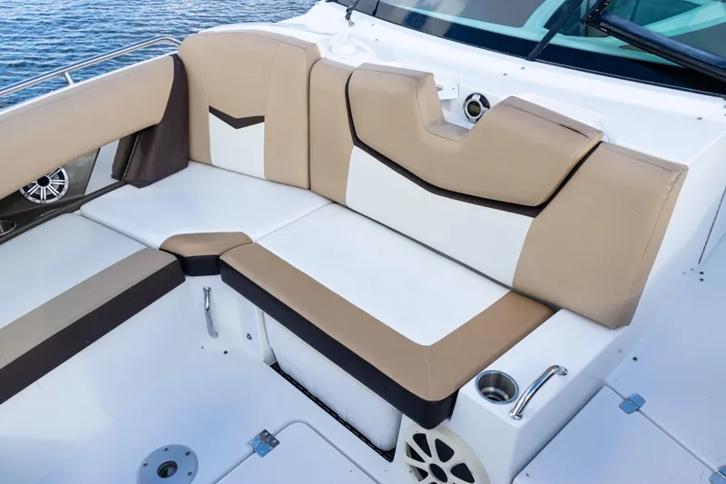 Slide: The Image of 2015 Cruisers Yachts 338 Bow Rider on water, showcasing sleek design and spacious interior. - 12