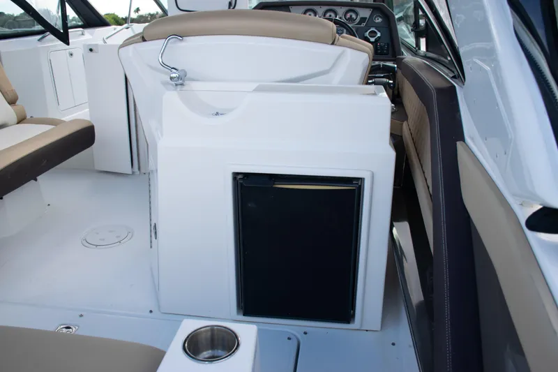 Slide: The Image of 2015 Cruisers Yachts 338 Bow Rider dashboard with steering wheel and navigation controls. - 21