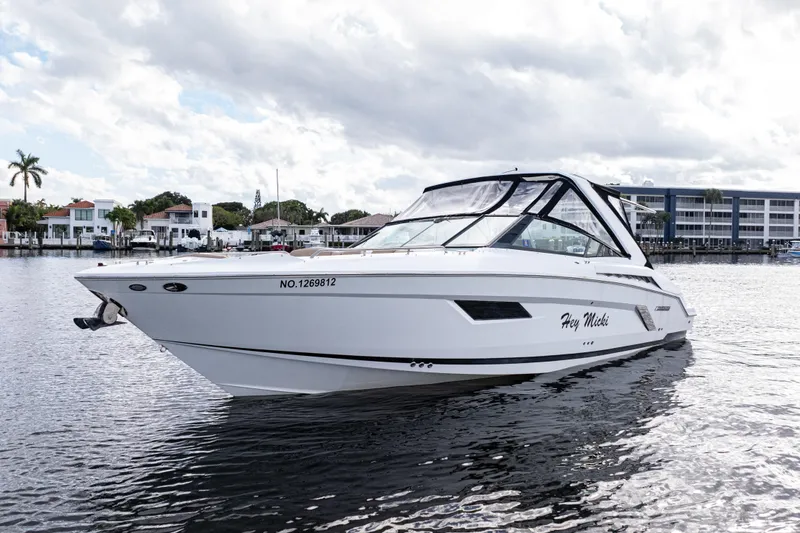 Slide: The Image of 2015 Cruisers Yachts 338 Bow Rider on water, with modern design and sleek lines. - 5