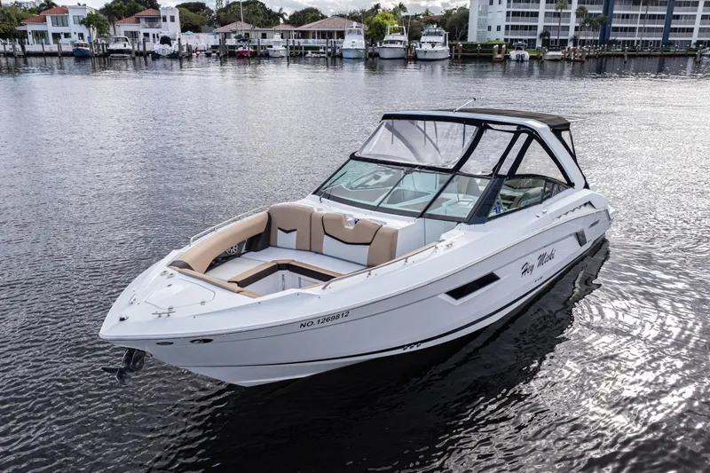 Slide: The Image of 2015 Cruisers Yachts 338 Bow Rider on water, with modern design and spacious seating. - 6