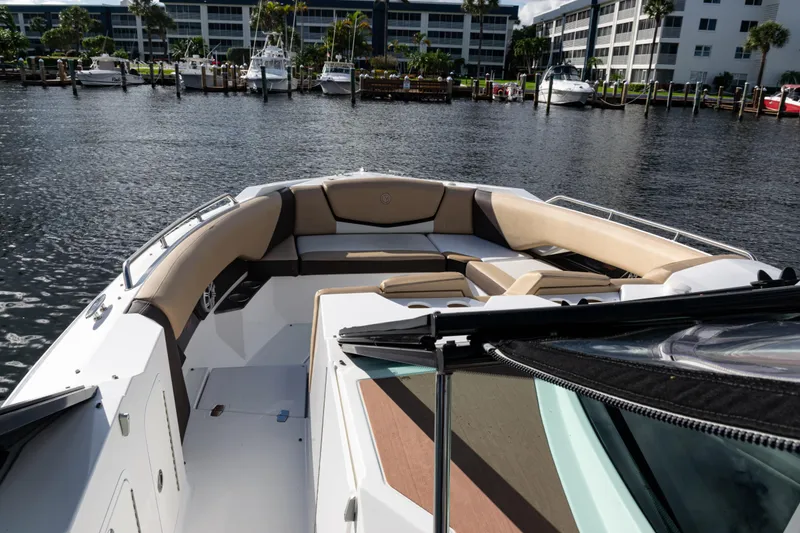 Slide: The Image of 2015 Cruisers Yachts 338 Bow Rider with spacious seating on calm water. - 8
