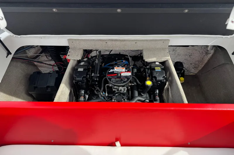 Slide: The Image of Engine compartment of a 2007 Ebbtide 180 SE boat, featuring a MerCruiser engine. - 15
