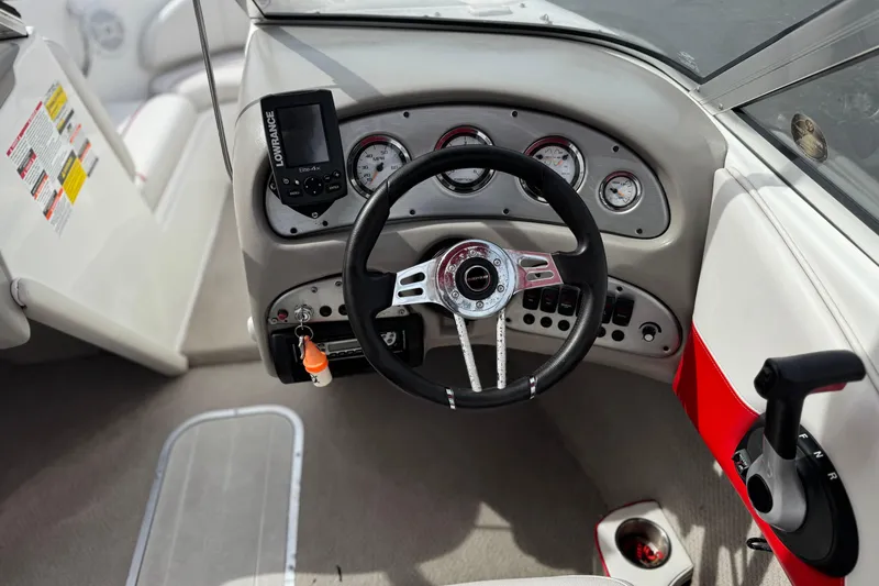 Slide: The Image of 2007 Ebbtide 180 SE boat dashboard with steering wheel and gauges. - 22