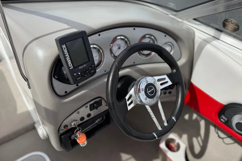 Slide: The Image of 2007 Ebbtide 180 SE boat dashboard with steering wheel and Lowrance Elite-4x fishfinder. - 23