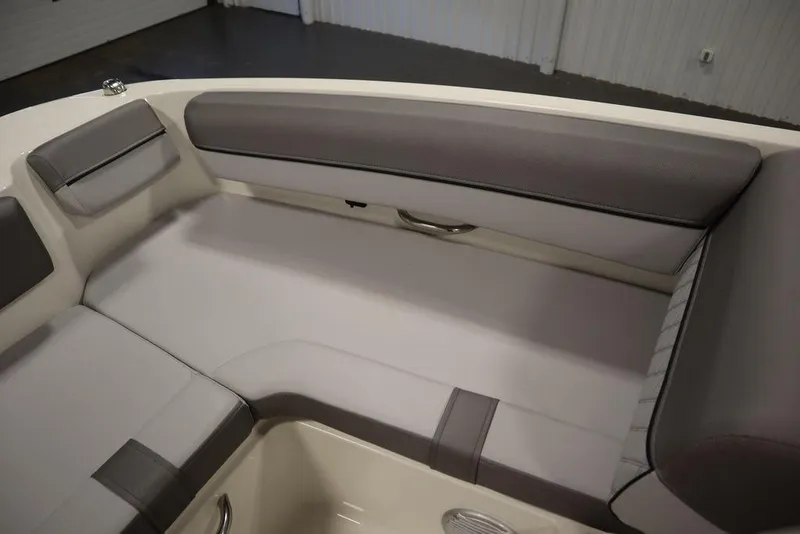 Slide: The Image of 2024 Bayliner 2050 DX interior seating with gray and white upholstery. - 19