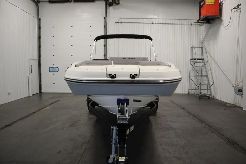 Slide: The Image of 2024 Bayliner 2050 DX boat in indoor storage facility. - 2