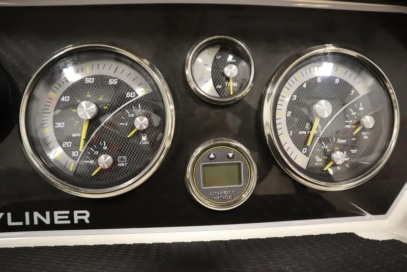 Slide: The Image of Dashboard of 2024 Bayliner 2050 DX boat with analog gauges and digital display. - 25