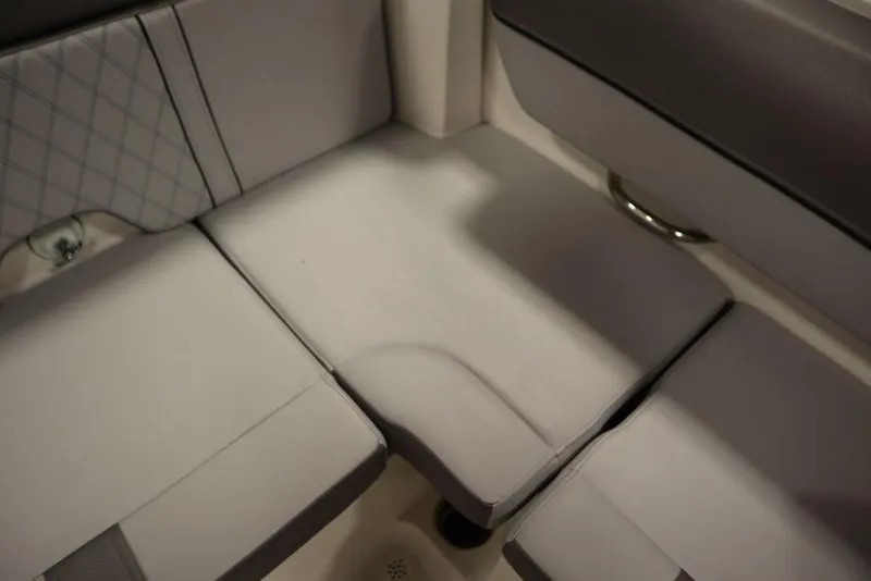 Slide: The Image of 2024 Bayliner 2050 DX boat interior seating with gray upholstery. - 40