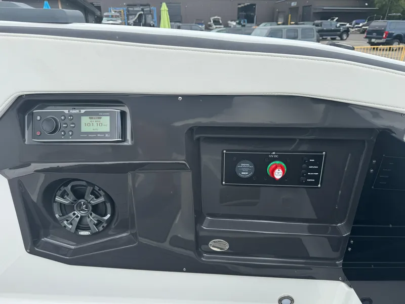 Slide: The Image of Control panel of a 2018 Monterey 258 Super Sport boat with radio and speaker. - 13