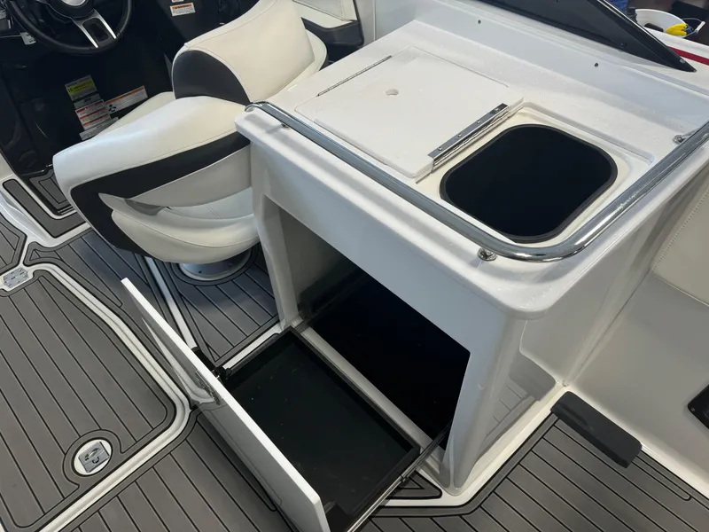 Slide: The Image of 2018 Monterey 258 Super Sport interior with seating and storage compartments. - 15