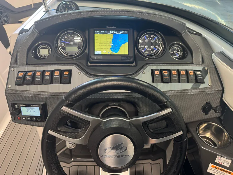 Slide: The Image of Dashboard of a 2018 Monterey 258 Super Sport boat with navigation display and controls. - 17