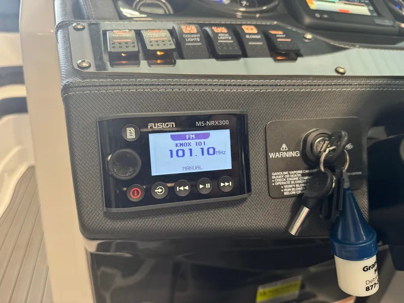 Slide: The Image of Control panel of a 2018 Monterey 258 Super Sport boat with radio and ignition keys. - 20