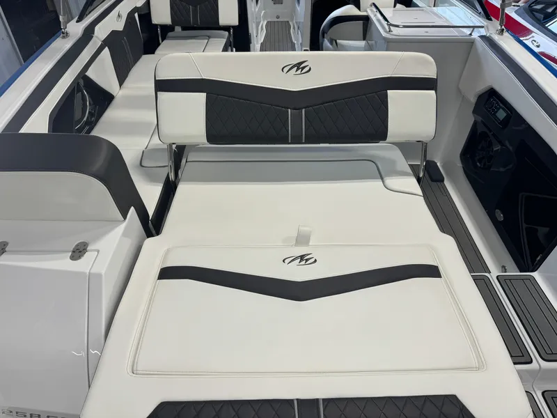 Slide: The Image of 2018 Monterey 258 Super Sport boat interior with white and black seating. - 21