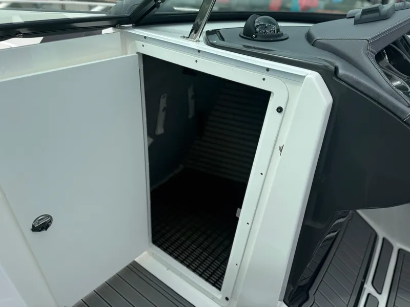 Slide: The Image of Open storage compartment on a 2018 Monterey 258 Super Sport boat. - 28