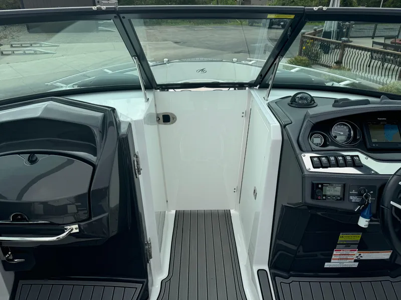 Slide: The Image of 2018 Monterey 258 Super Sport boat interior with dashboard and seating area. - 36
