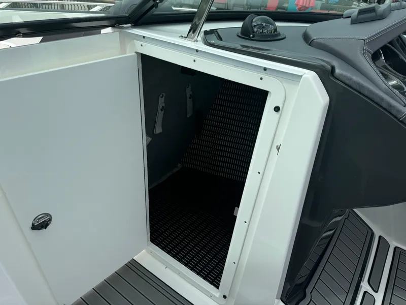 Slide: The Image of Open storage compartment on 2018 Monterey 258 Super Sport boat interior. - 37
