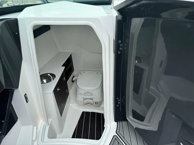 Slide: The Image of 2018 Monterey 258 Super Sport boat interior with compact bathroom and sink. - 40
