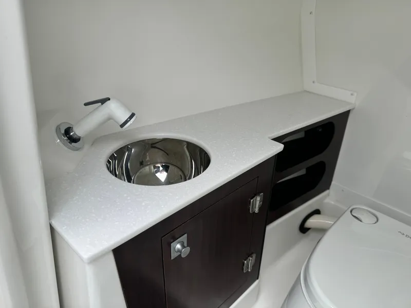 Slide: The Image of 2018 Monterey 258 Super Sport boat bathroom with sink, faucet, and storage cabinet. - 41
