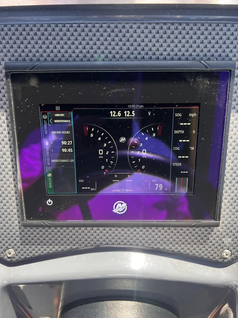 Slide: The Image of Dashboard display of a 2019 Cruisers Yachts 338 IO boat, showing gauges and controls. - 15
