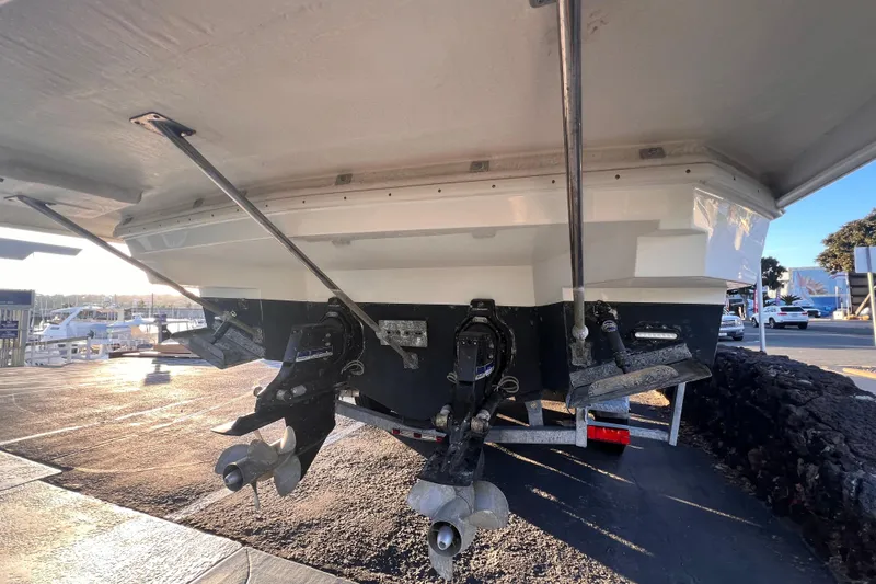 Slide: The Image of 2019 Cruisers Yachts 338 Bow Rider, rear view showing dual propellers and outboard motors. - 55
