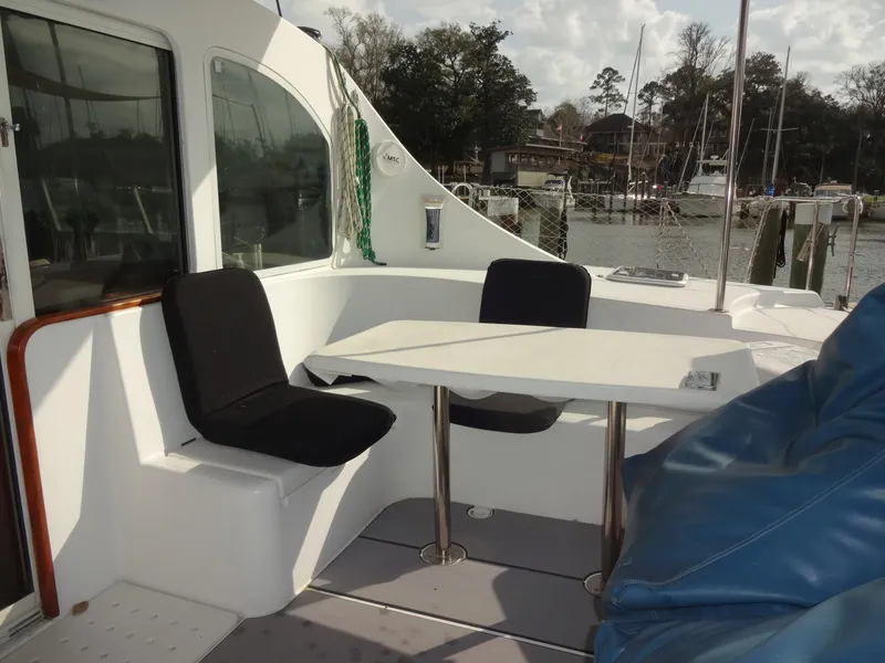 Slide: The Image of Lagoon 410 catamaran cockpit with table and seats, year 2003. - 21