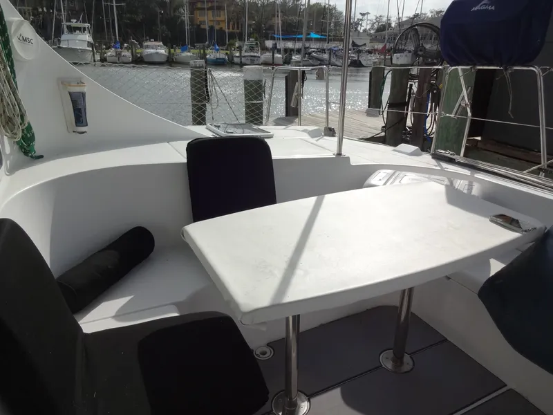 Slide: The Image of Interior of a 2003 Lagoon 410 yacht with table and seating. - 23