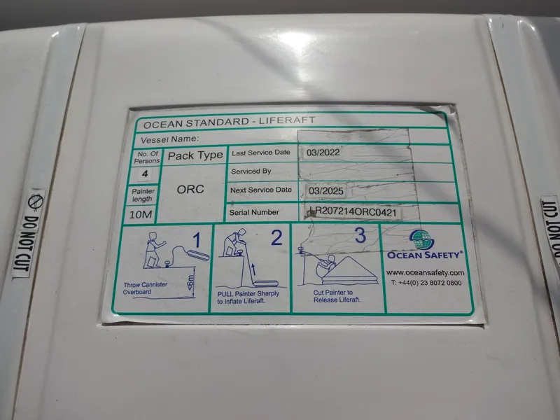 Slide: The Image of Ocean Standard liferaft with service dates and instructions. - 25