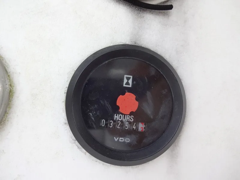 Slide: The Image of Hour meter on Lagoon 410 boat, displaying 3254 hours. - 26